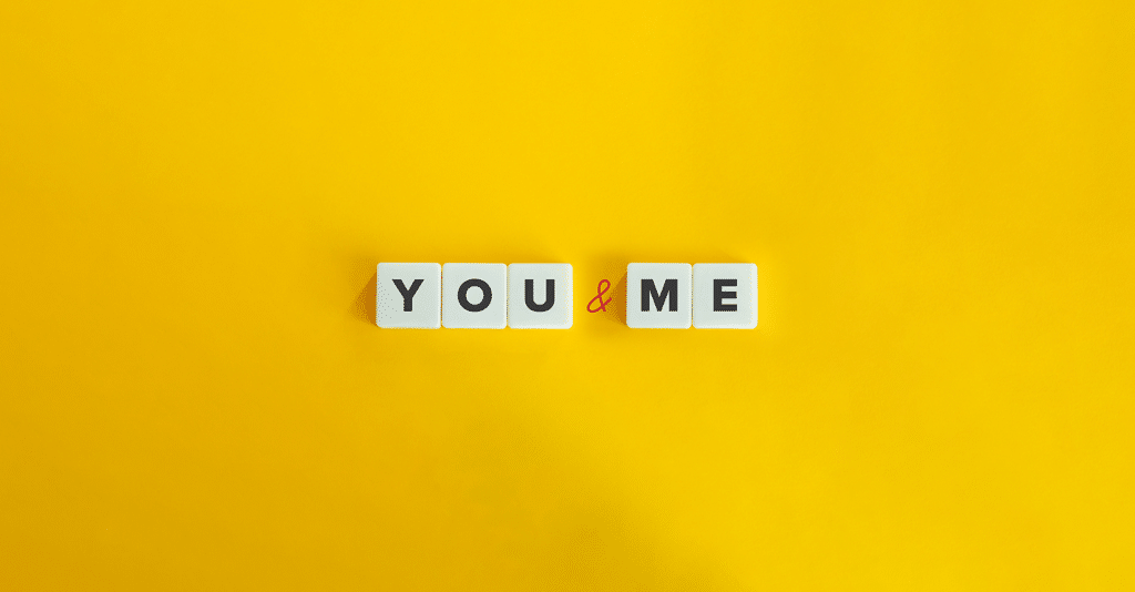 The words "you" and "me" in a yellow background.