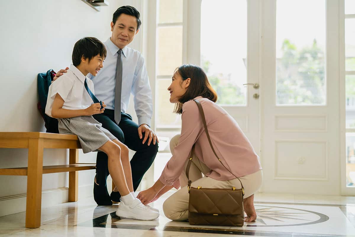 Asian family, father, mother and son are preparing for school.