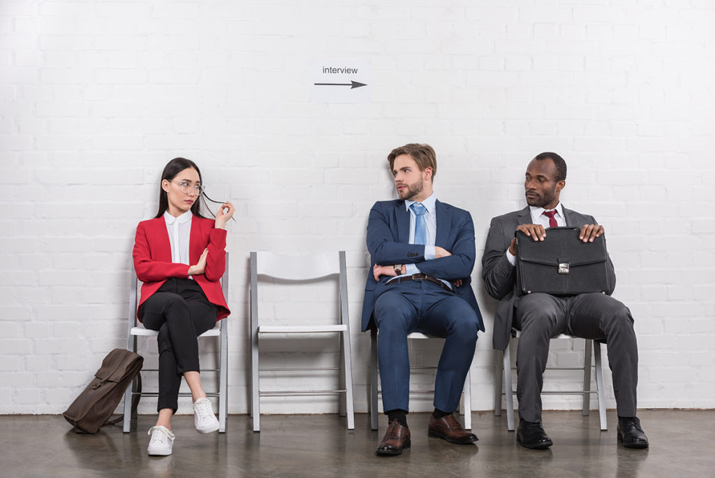 multiethnic business people looking at each other while